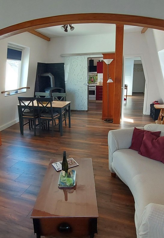 Liebenstein living and dining room with wood stove | © Heimes